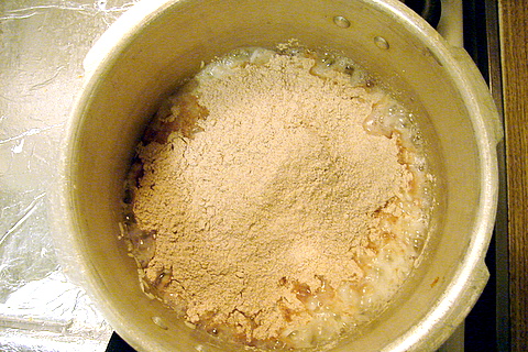 Ragi flour heaped on cooked rice